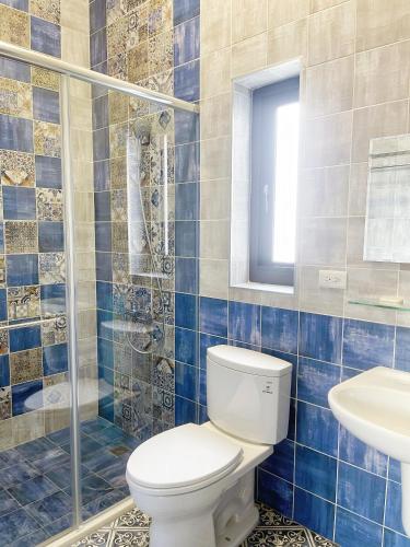a bathroom with a toilet and a sink at 光域文旅 in Hualien City