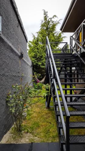 a set of stairs next to a building at Antarctica Hostel in Ushuaia
