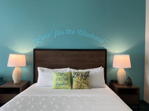 a bedroom with a bed with a blue light above it at The Lodge at Camp Margaritaville in Pigeon Forge