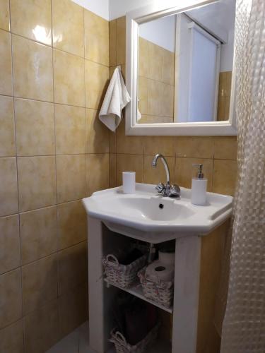 a bathroom with a sink and a mirror at Terra Calma in Kalymnos