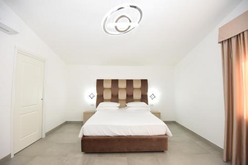 Postel nebo postele na pokoji v ubytování Agriturismo Borgo Imperiale