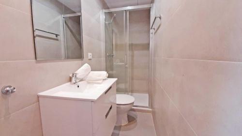 a bathroom with a shower and a toilet and a sink at 1 Sire - Llafranc in Calella de Palafrugell