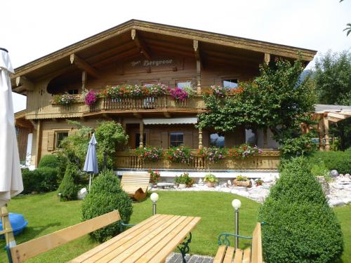 a house with a bench in front of it at Appartement Bergrose in Hopfgarten im Brixental