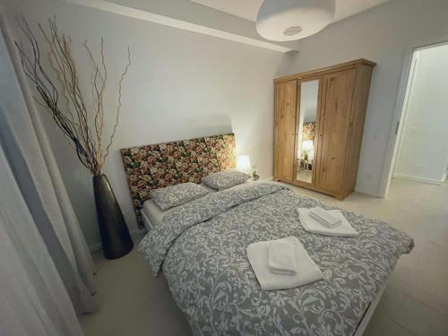מיטה או מיטות בחדר ב-Bonjour Apartment