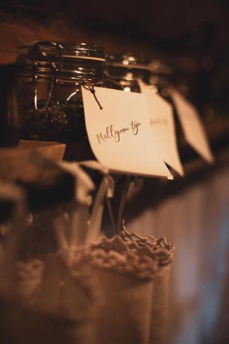 a piece of paper sitting on top of a jar of food at LODĒNU namiņš in Bauska