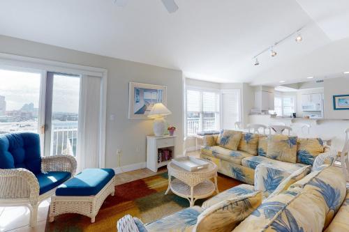 a living room with a couch and chairs at Mahalo 402 in Ocean City
