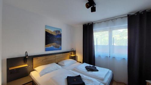 Postel nebo postele na pokoji v ubytování Mountain Living Ötztal