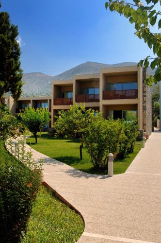 a building with a walkway in front of it at Blue Sea Beach Affiliated By Melia in Stalida