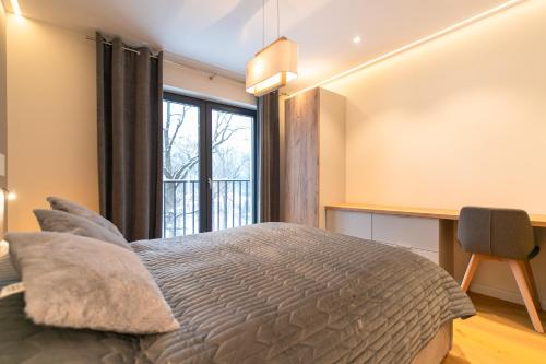Posteľ alebo postele v izbe v ubytovaní Luksusowy Apartament Enklawa pod Skrzycznem z sauną i bilardem - Dream Apart