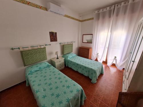 Кровать или кровати в номере casa perla