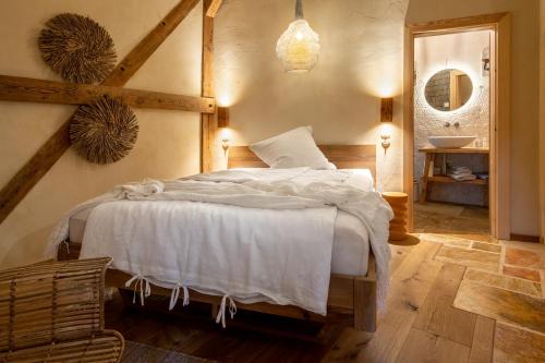 a bedroom with a bed and a sink in it at Gut Leben Landresort in Bernau bei Berlin