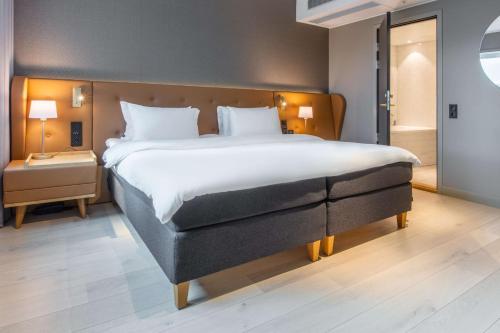 Ένα ή περισσότερα κρεβάτια σε δωμάτιο στο Radisson Blu Atlantic Hotel, Stavanger