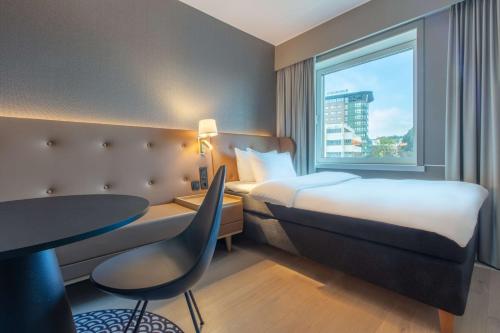 Ένα ή περισσότερα κρεβάτια σε δωμάτιο στο Radisson Blu Atlantic Hotel, Stavanger