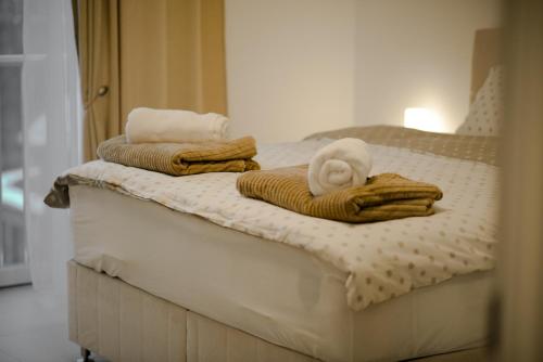 Ένα ή περισσότερα κρεβάτια σε δωμάτιο στο BujRoom apartments