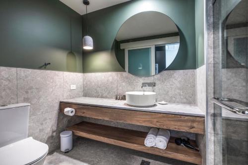 a bathroom with a sink and a mirror at The Sands by Nightcap Plus in Carrum Downs