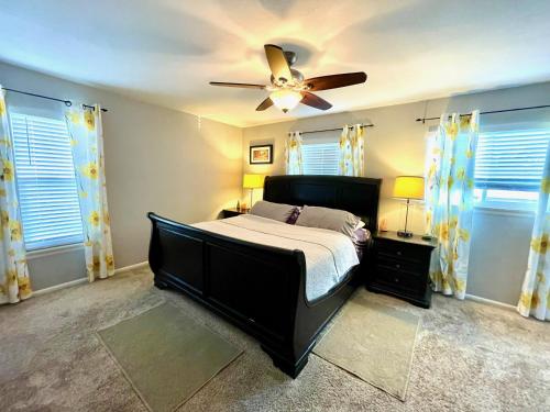 a bedroom with a bed and a ceiling fan at Entire House - Red Rocks Amphitheater in Lakewood