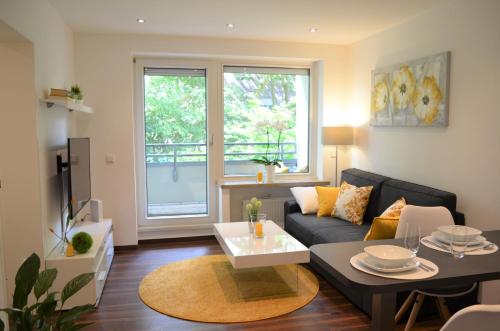 Гостиная зона в Gemütliches und Modernes Apartement in Grünen Top-Lage Münster