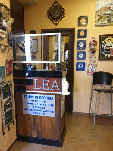 a store with a sign on a counter in a room at Lea Guest House in Tbilisi City
