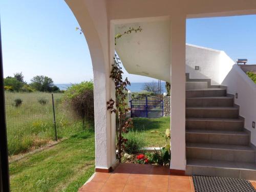 a view from the entrance to a house with stairs at Ananias House in Karianí