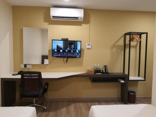 TV a/nebo společenská místnost v ubytování T SQUARE HOTEL (IPOH)