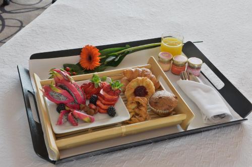 a tray with a plate of food on a table at Holiday Inn Montreal Centre Ville Downtown by IHG in Montréal