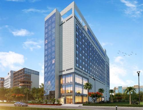 a rendering of a tall office building at Radisson Blu Towers Kaushambi Delhi NCR in Ghaziabad
