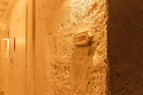 a street sign on the side of a wall at MASSERIA SCALEDDA in Manduria