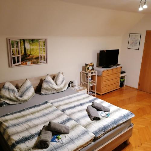 a bedroom with a large bed with pillows on it at Apartment Schloffer in Weiz