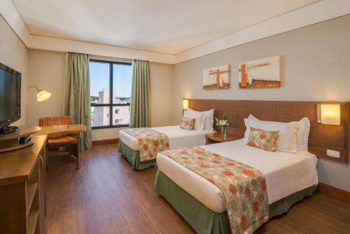 Cama ou camas em um quarto em Blue Tree Towers Caxias do Sul