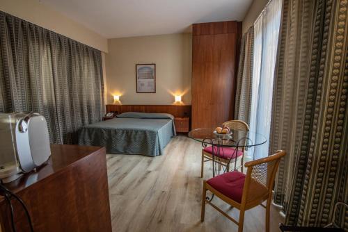 Postel nebo postele na pokoji v ubytování Hotel Petra