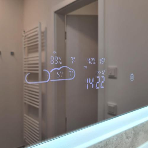 a mirror in a bathroom with writing on it at Penthouse - Sterntaucher in Glowe
