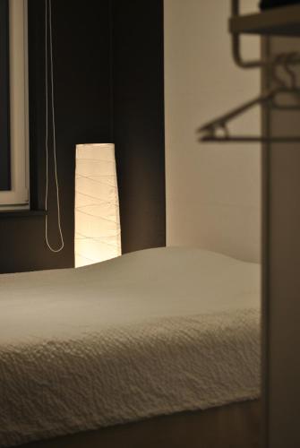 Ein Bett oder Betten in einem Zimmer der Unterkunft Un espace au bord de l'eau