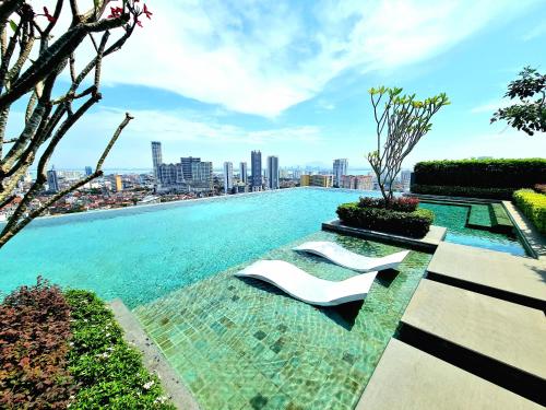a swimming pool with a view of a city at Beacon Executive Suites in George Town