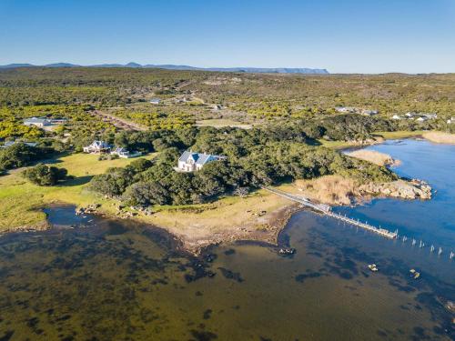 an aerial view of a small island in the water at Coot Club in Stanford