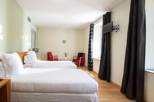 Un pat sau paturi într-o cameră la L'Ortensia