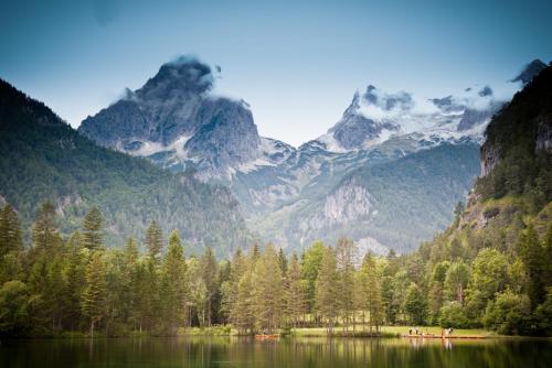 a view of a mountain range with a lake and trees at Appartement Hess Hinterstoder in Hinterstoder