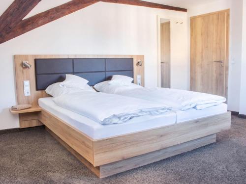 Postelja oz. postelje v sobi nastanitve Gasthof Landhotel Hirsch