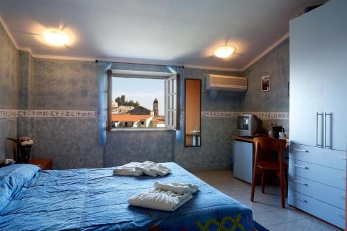 Postel nebo postele na pokoji v ubytování Hotel Food & Drink