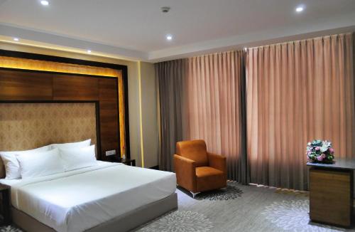 Ένα ή περισσότερα κρεβάτια σε δωμάτιο στο Hotel Hills