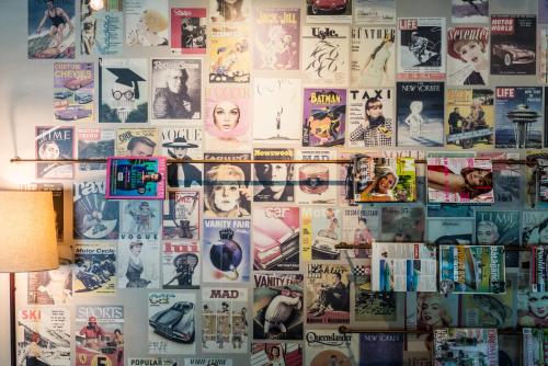 a wall with lots of posters on it at Scandic Uppsala Nord in Uppsala