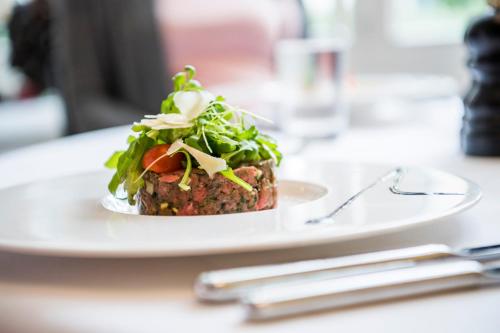 a plate of food sitting on a table at Hotel Schützen Rheinfelden in Rheinfelden