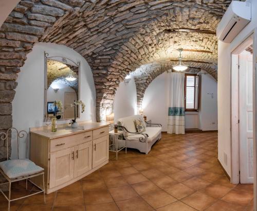 a bathroom with a sink and a mirror in a room at Bosa Queen House in Bosa