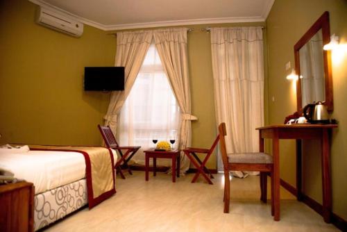 Ένα ή περισσότερα κρεβάτια σε δωμάτιο στο Masailand Safari Lodge