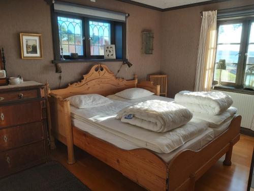 a bedroom with a bed with two pillows on it at Backlund Boende i Dalarna in Rättvik