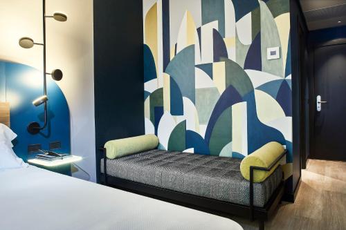 A bed or beds in a room at Belstay Milano Assago