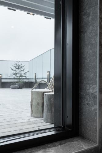 a window in a building looking out at a courtyard at Lapland Hotels Arena in Tampere
