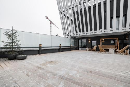 a large patio on the side of a building at Lapland Hotels Arena in Tampere