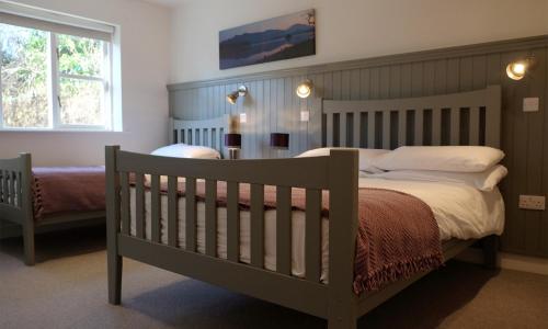 Кровать или кровати в номере Ballyvaughan Cottages