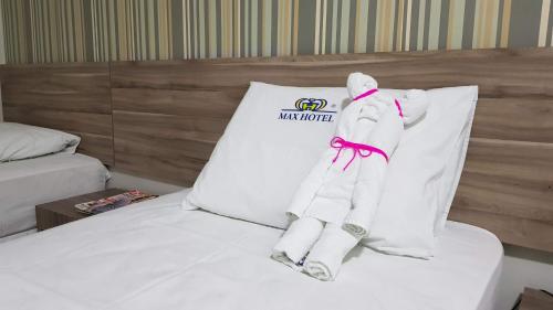 Postel nebo postele na pokoji v ubytování Max Hotel
