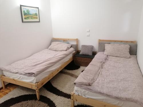 A bed or beds in a room at Pusztaszemes Vendéghaz